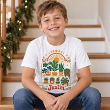 botanical personalized kids shirt retro boho style for sale, whimsical illustrated greenery and leaf patterns with warm vintage color palette, lightweight breathable cotton blend material ideal for all-day comfort, nature-inspired apparel celebrating botanical beauty and retro vibes, delightful wardrobe staple for adventurous young nature enthusiasts, thoughtful personalized gift for children who adore boho aesthetics and plant themes