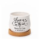 charming personalized ceramic wedding favor pot for sale, versatile mini planter for candles or botanicals, custom names and date printed, includes natural wood drainage tray, couple keepsake
