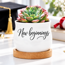buy Succulent Pot - New beginnings online, ceramic mini planter with natural wood tray, gently curved design, functional drainage system included, charming desk decor or gift option