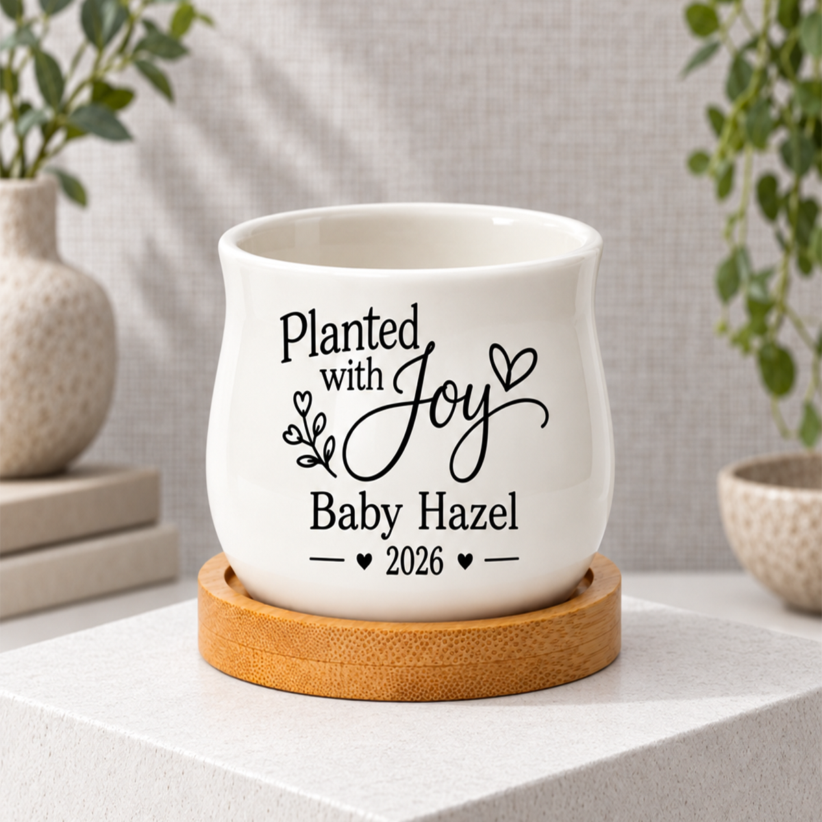 buy personalized ceramic mini pot for baby shower favor planted with joy online, glazed white finish with custom name printing, small decorative planter with included tray, charming botanical themed gift for expectant parents