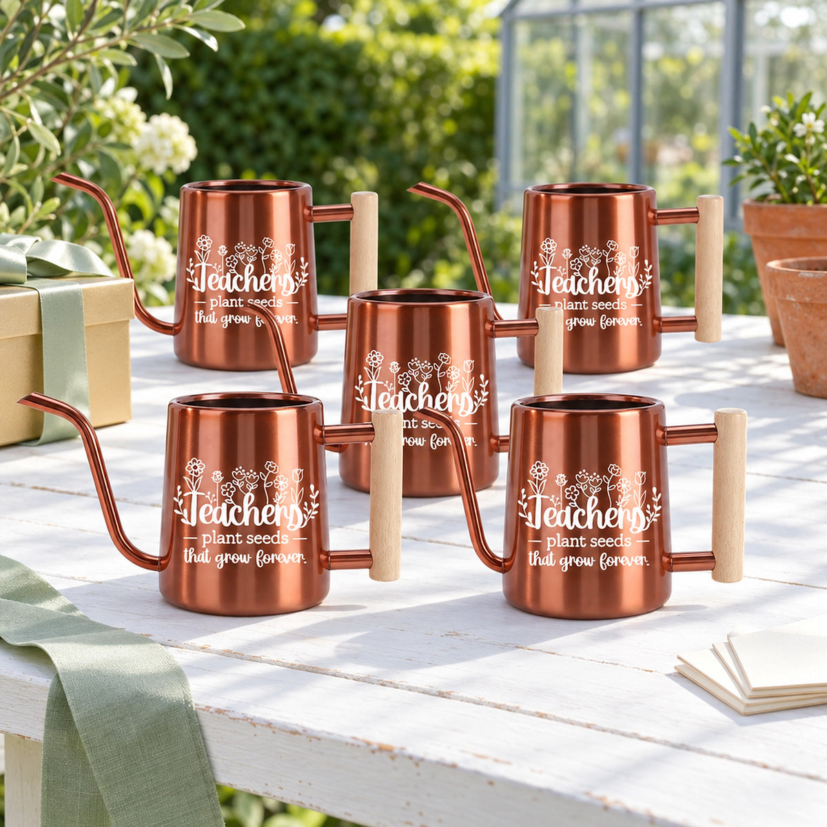 buy 10-Pack orange Pack of Teacher Gift Watering Can - Plant Seeds That Grow Forever online, ten bright orange watering cans, vibrant powder coat, lightweight metal, suitable for outdoor pots, perfect for community gardens, fun group gift for teachers