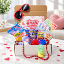 collection of small valentine's day gift boxes stacked together showing festive red and pink packaging with heart designs and colorful tissue paper peeking out from the top