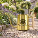 buy watering can drawn to the bloom black online, charming illustrated design with delicate floral artwork, durable plastic construction available in black orange gray or pink, ergonomic handle for easy pouring, ideal for indoor houseplants and garden beds, perfect gardening gift for plant enthusiasts