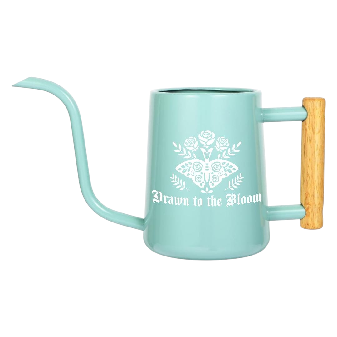 orange Watering Can - Drawn to the Bloom for sale, bold orange coloring with detailed floral artwork, angled spout for targeted watering, vibrant aesthetic presence, perfect for colorful garden displays and decorative arrangements, wonderful gift for creative gardeners