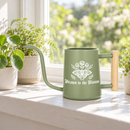buy watering can drawn to the bloom black online, charming illustrated design with delicate floral artwork, durable plastic construction available in black orange gray or pink, ergonomic handle for easy pouring, ideal for indoor houseplants and garden beds, perfect gardening gift for plant enthusiasts