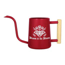 buy watering can drawn to the bloom black online, charming illustrated design with delicate floral artwork, durable plastic construction available in black orange gray or pink, ergonomic handle for easy pouring, ideal for indoor houseplants and garden beds, perfect gardening gift for plant enthusiasts