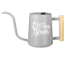 gray watering can let love bloom for sale, soft gray muted tone with romantic floral print, contemporary minimalist shape with functional spout, durable powder-coated metal with sealed seams, ideal for mixed container gardens and patio displays, excellent gift for modern home gardeners