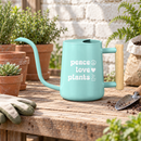 pink watering can peace love plants for sale, cheerful coral pink with motivational wellness-focused design, practical 1-liter size with precision spout technology, stylish accent piece for bright modern interiors, great for maintaining herb gardens and kitchen plant collections, lovely gift for eco-conscious homemakers